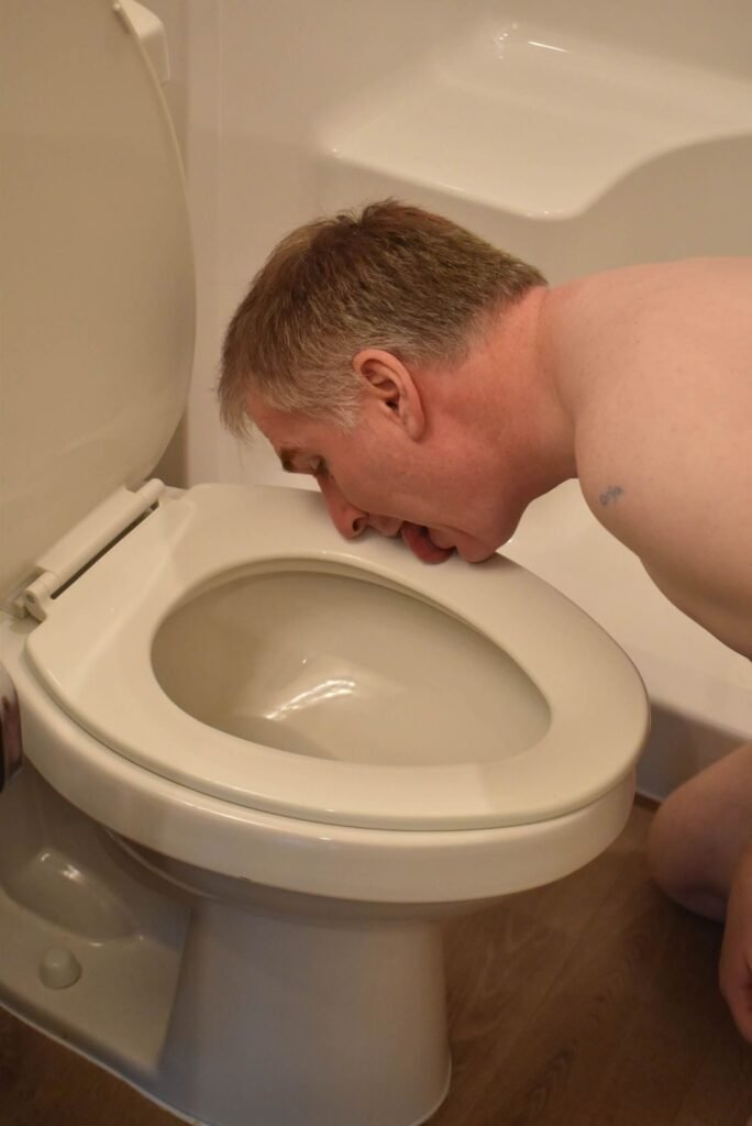 Faggot licking toilet seat