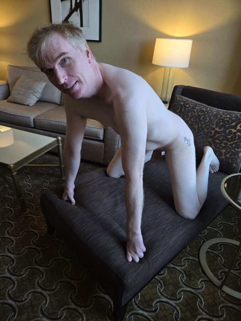 gay bdsm slave naked kneeling on all fours.