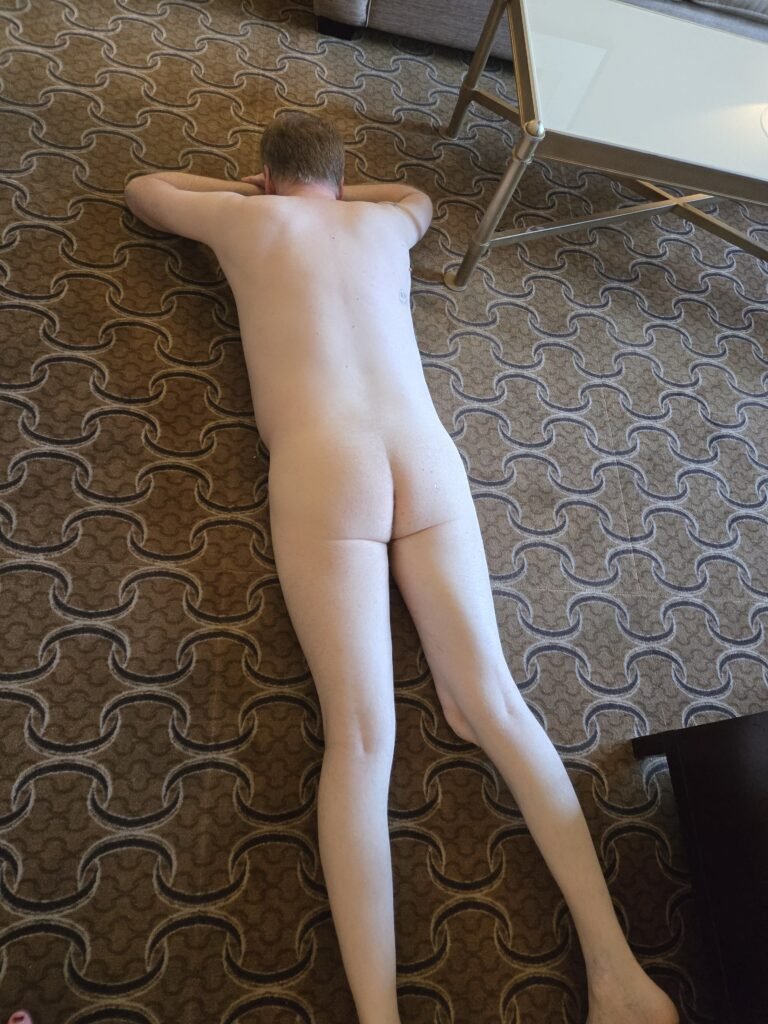 exposed faggot laying on floor naked showing his ass.