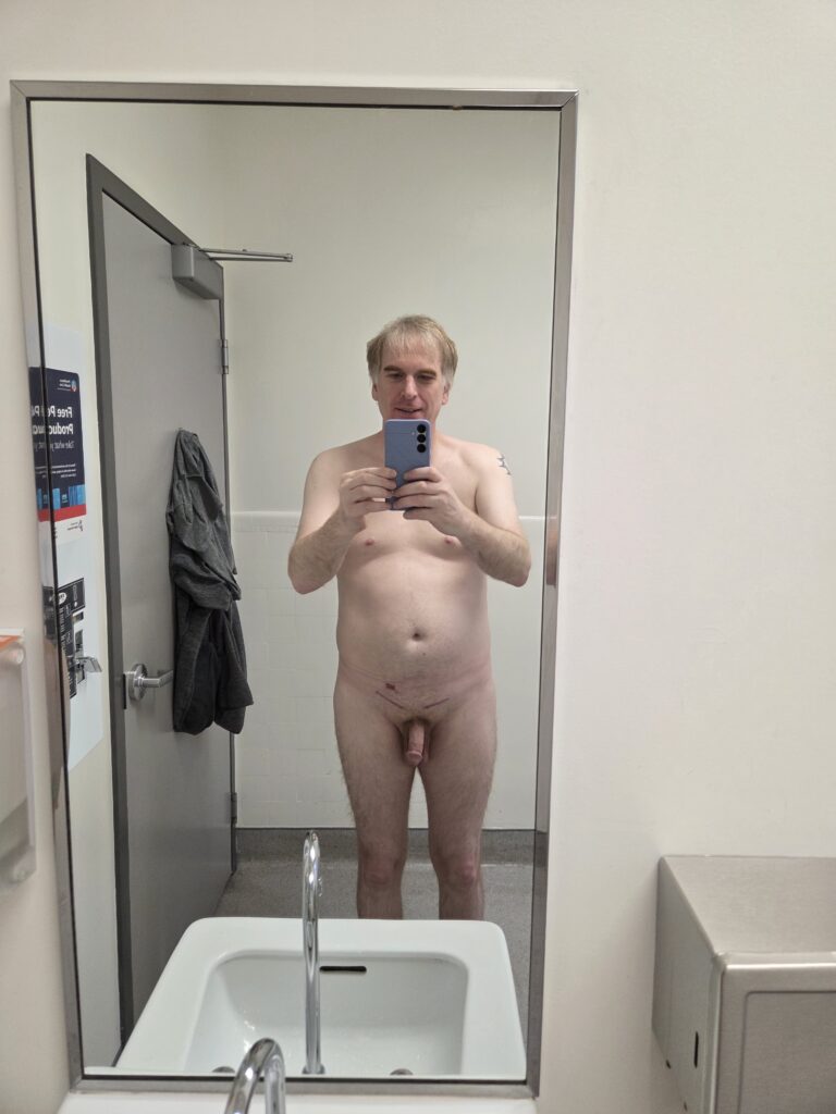 Naked Selfie In Public Bathroom 2 Naked mirror selfie in a public bathroom.
